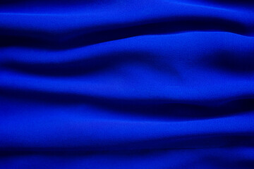 Blue fabric cotton background. display  abstract texture luxury cloth soft wave.  for well use text present or promote your goods, products on free space background. top view or flat lay.