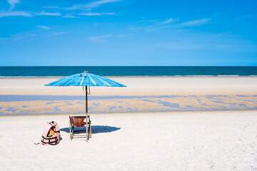 Tropical sea and beach with umbrella and deck chair wiht blue sky.Thai summer