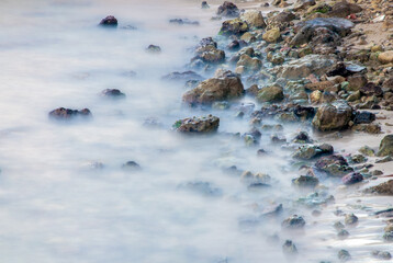 Silk effect of the seawater on the rocks in the coastline in Mallorca