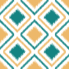 Ikat Geometric Seamless Pattern with Teal and Yellow Diagonal squares