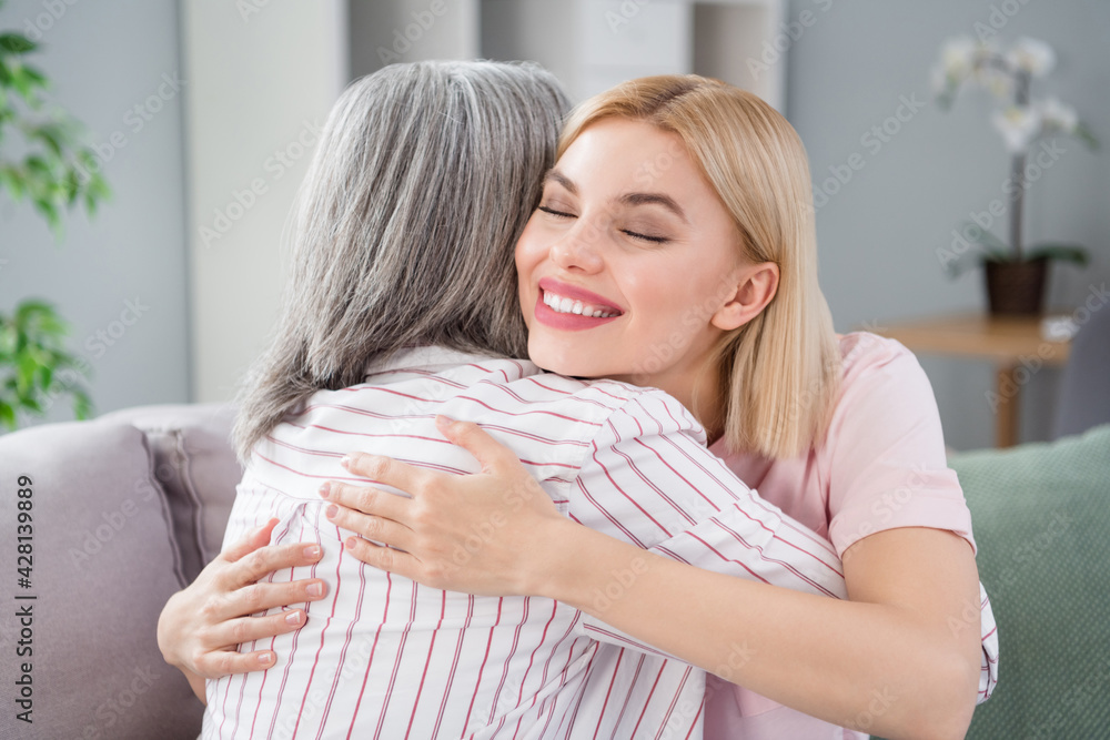 Canvas Prints Photo of happy calm nice cheerful family mom and daughter hug smile good mood indoors inside house home