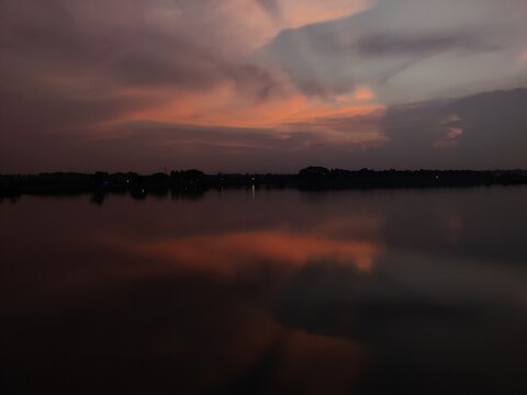 Sunset Over The River With Chill Vibes And Listening To Music