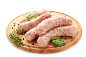 Raw sausages on cutting board isolated on white.