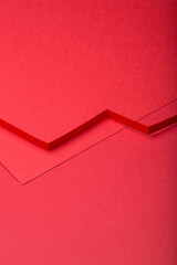 Abstract minimal paper background. Red cut out zig zag paper stripe on red background.