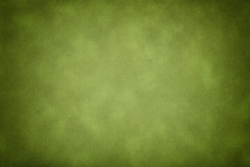 Texture of dark green old paper, crumpled background with vignette. Vintage olive grunge surface backdrop with gradient.