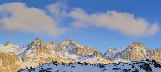 Admiring the grandeur of the mountains and the vividness of the sunset.