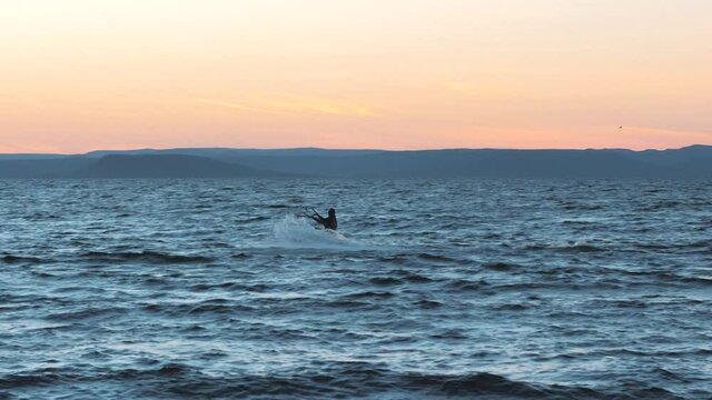 01 September, 2018. Vladivostok city, Russia. Kite-surfing against a beautiful sunset. Silhouette of kitesurfer. Holidays on nature. Artistic picture.