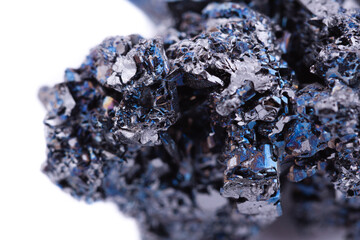 Macro mineral stone covellite on white background