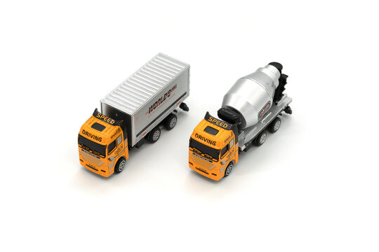 Cargo delivery and cement mixer toy truck on white background.
