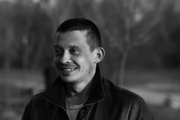 Black and white portrait of a smiling man