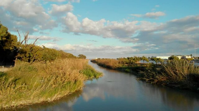 Scenery with fluffy clouds in the blue sky at sunny day, Sierra de Segura river in southeastern Spain. Guardamar del Segura. Costa Blanca, Provine of Alicante. Spain