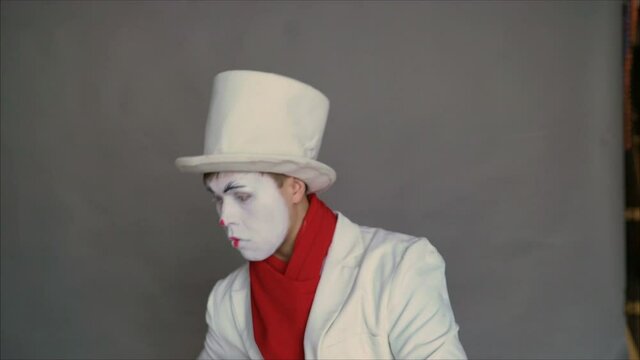 Mime juggles invisible items. Circus fashion pantomime juggles.