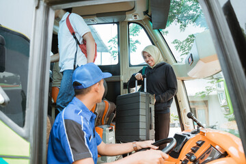 Naklejka premium the bus driver turned to see a woman in a veil carrying a suitcase on board the bus