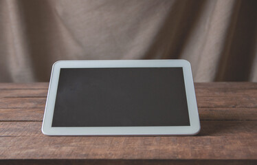 Office workplace with tablet pc on the table.