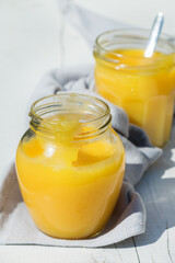 Homemade lemon curd, custard cream with yellow fruits