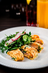 ham and cheese omelet with salad and arugula for breakfast