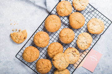 Freshly baked homemade vegan oatmeal cookies with cereals - flax seed, sesame and sunflower. Useful snack. Traditional breakfast. The concept of healthy eating. Selective Focus