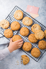 Freshly baked homemade vegan oatmeal cookies with cereals - flax seed, sesame and sunflower. Useful snack. Traditional breakfast. The concept of healthy eating. Selective Focus