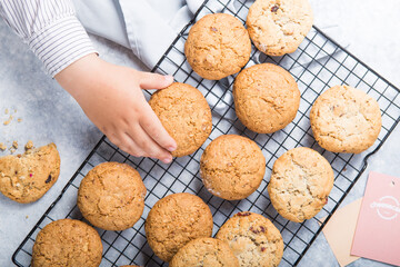 Freshly baked homemade vegan oatmeal cookies with cereals - flax seed, sesame and sunflower. Useful snack. Traditional breakfast. The concept of healthy eating. Selective Focus