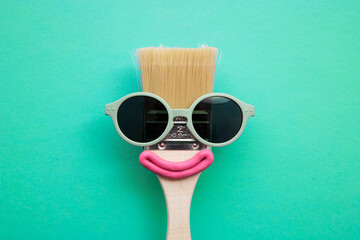 Paint brush diy character with sunglasses and smile