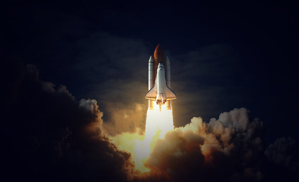 Space Shuttle takes off into space. Elements of this image furnished by NASA.