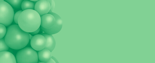 Green toned balloons background, punchy pastel and soft focus. mint balloons photo wall birthday decoration. Copy space. Web banner. Wedding party.