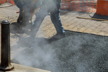 New road construction a repair asphalt covering while laying asphalt