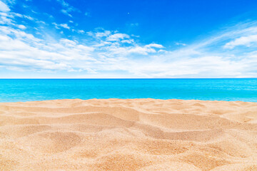 Fototapeta na wymiar Summer Vacation and Travel Holiday Concept : Sand beach and blurred seascape view blue sky in background.
