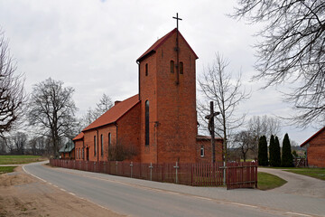 Built in the neo-Gothic style of red ceramic brick in 1921, the Catholic Church of St. Andrew the...
