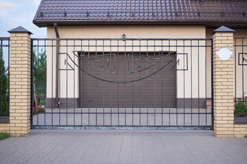 Metal sliding gates for entering a garage private house.