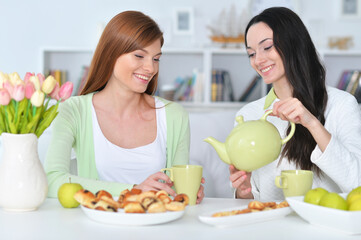 two female friends drinking tea