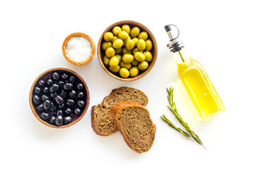 Italian food with olives bread and olive oil. Overhead view