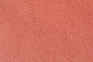 Stucco texture ocher color on the exterior walls of the houses