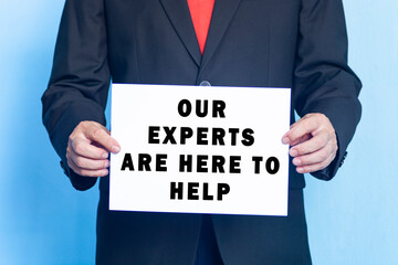 A business man holding a paper with text on a blue background