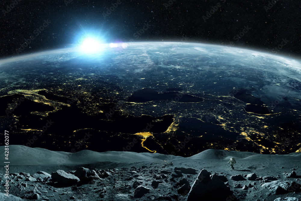 Poster space man walks on the moon in outer space with a amazing blue planet earth and sunset on the horizo