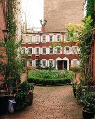 Fototapeta na wymiar Garden and houses in Grove Court, in the West Village, Manhattan, New York City