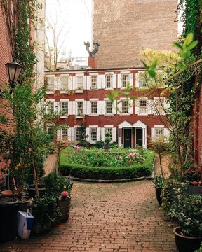 Garden and houses in Grove Court, in the West Village, Manhattan, New York City