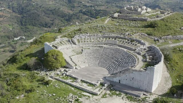Ancient theater of Segesta partly excavated in the rock of the hill. Segesta Archaeological Park in the province of Trapani. Ancient Sicily.