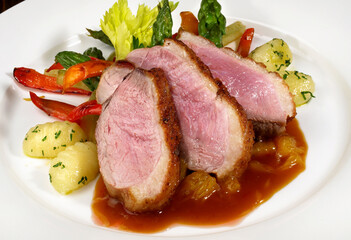 Roasted Duck with Orange Sauce on white Background - Isolated