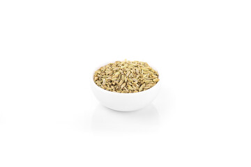 fennel seed. dry fennel seed in white bowl on white background. fennel