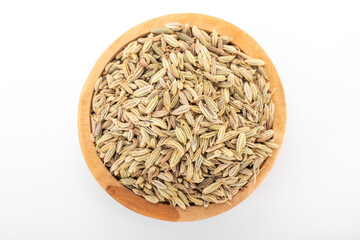 fennel seed. dry fennel seed in wooden bowl on white background. fennel