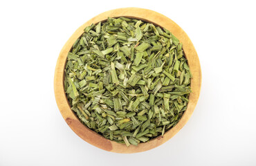 dry chopped spring onion  in wooden bowl on white background. dry chopped or scallion. dry green onion, chopped onion, chopped spring onion.