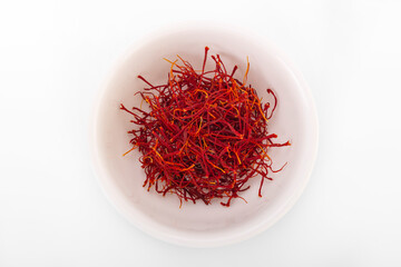 saffron. dried saffron in white bowl on white background. saffron spice