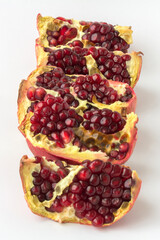 Red ripe juicy garnet fruit pomegranate grains closeup macro 