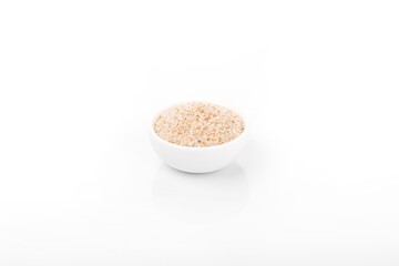 psyllium husk. psyllium husk in white bowl on white background.
