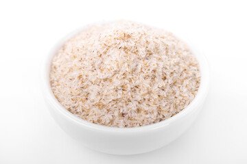 psyllium husk. psyllium husk in white bowl on white background.