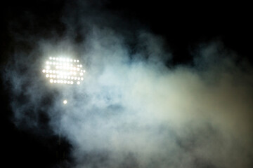 Big spotlight on the stadium at night