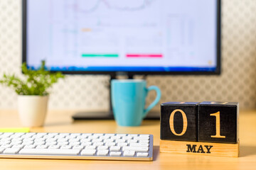 May 1st. Day 1 of may month, calendar at workplace, on office table. Spring time