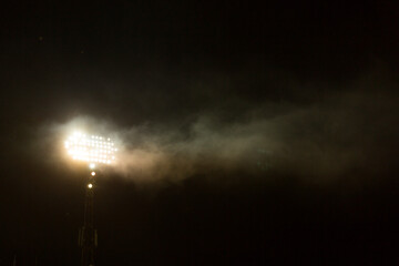 Big spotlight on the stadium at night