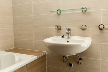 Bathroom with brown tiles